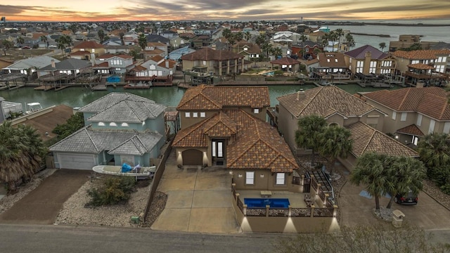 13525 Queen Johanna Ct, Corpus Christi, TX 78418 - aerial view at dusk of a residential view and a water view