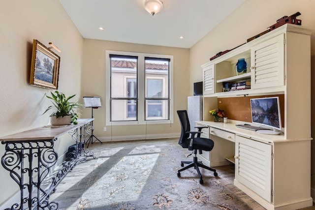 office space featuring baseboards, built in study area, and recessed lighting