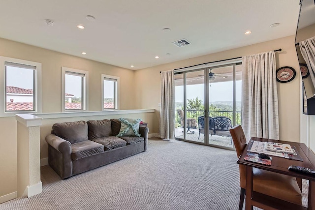 living room featuring baseboards, carpet flooring, visible vents, and recessed lighting