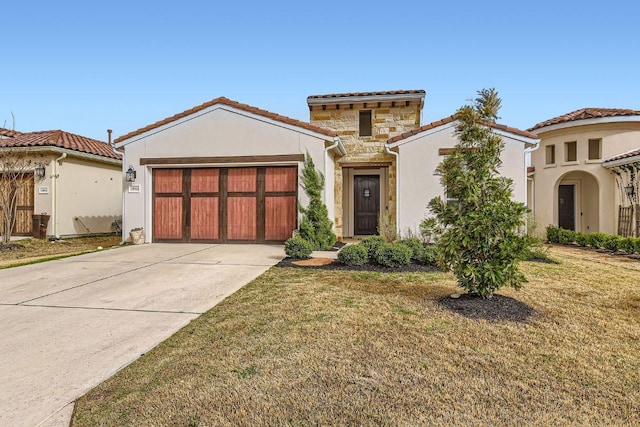12012 Beautybrush Dr, Austin, TX 78738 - mediterranean / spanish-style home with concrete driveway, stone siding, a tile roof, an attached garage, and stucco siding