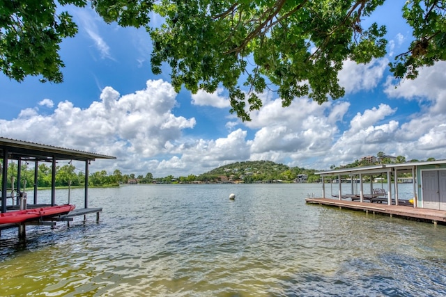 view of dock featuring a water view and boat lift