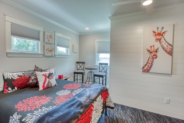 bedroom featuring ornamental molding and multiple windows