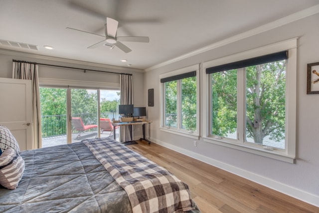 bedroom featuring baseboards, visible vents, wood finished floors, access to outside, and crown molding