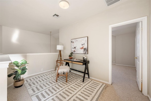 carpeted home office with baseboards and visible vents