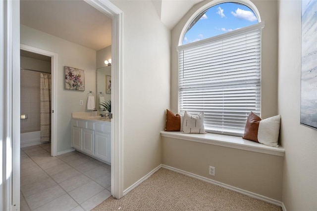 full bath with tile patterned flooring, baseboards, vanity, and curtained shower