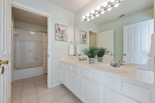 bathroom with a sink, visible vents, tile patterned floors, double vanity, and shower / bath combination with curtain