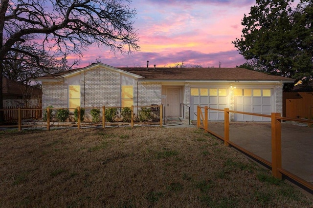 view of front of property featuring a garage, brick siding, fence, concrete driveway, and a front lawn