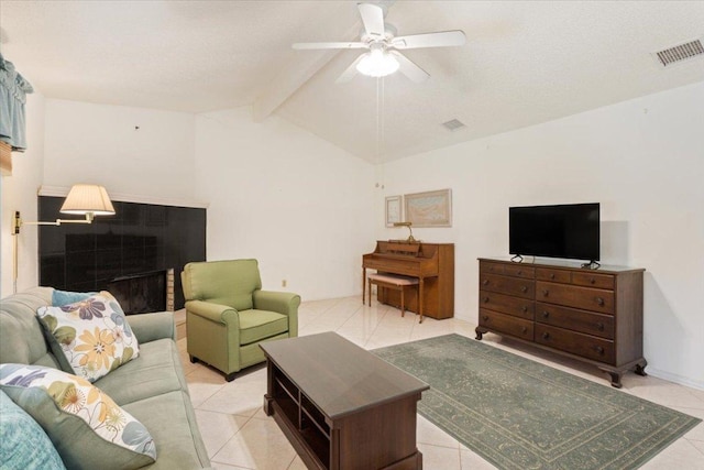 living area with lofted ceiling with beams, light tile patterned floors, visible vents, and a ceiling fan