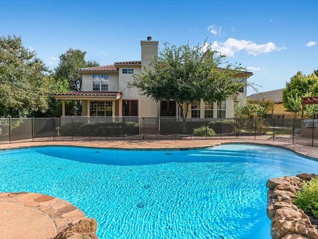 view of pool featuring a patio area, a fenced in pool, and fence