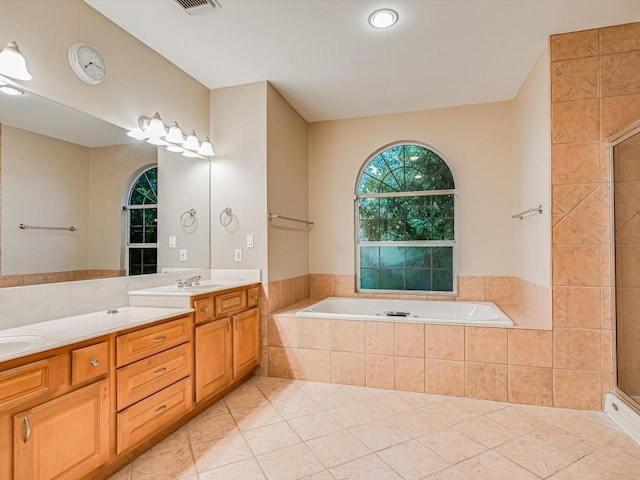 6 Wingreen Loop, The Hills, TX 78738 - full bath with a garden tub, double vanity, tiled shower, and tile patterned flooring