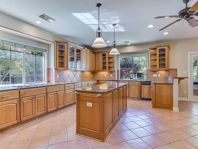 6 Wingreen Loop, The Hills, TX 78738 - kitchen with open shelves, a center island, decorative backsplash, light tile patterned floors, and glass insert cabinets