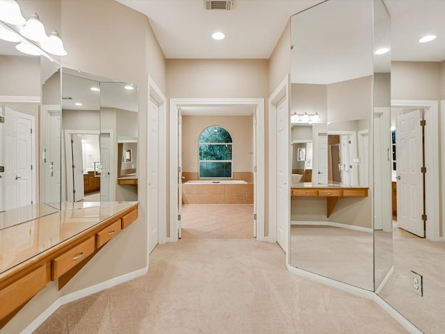 full bath with recessed lighting, visible vents, a garden tub, and vanity