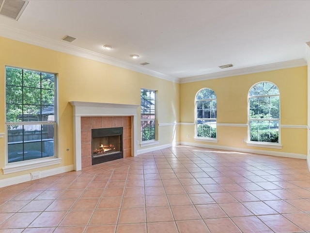 6 Wingreen Loop, The Hills, TX 78738 - unfurnished living room with crown molding, light tile patterned floors, a fireplace, and baseboards