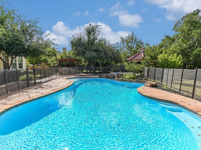 view of pool featuring fence and a fenced in pool