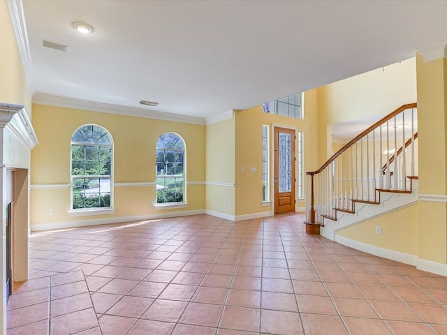 6 Wingreen Loop, The Hills, TX 78738 - foyer entrance featuring ornamental molding, light tile patterned floors, baseboards, and stairs