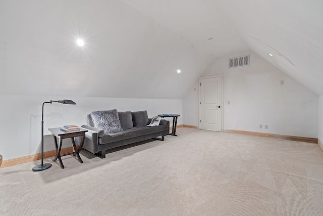 living area with lofted ceiling, visible vents, light carpet, and baseboards