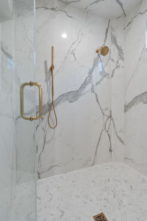 details featuring a marble finish shower