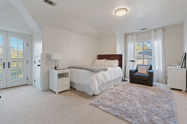 bedroom with access to outside, visible vents, light colored carpet, and french doors