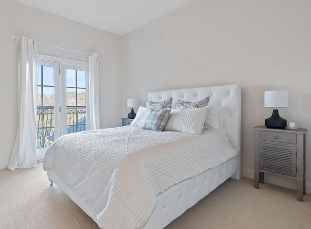 carpeted bedroom featuring access to outside