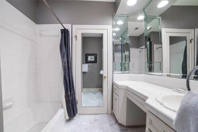 bathroom featuring visible vents, shower / tub combo with curtain, and vanity