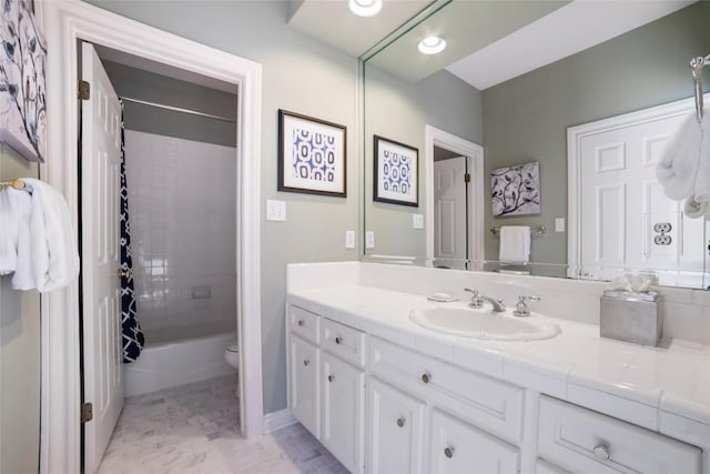 bathroom with toilet, shower / bath combination with curtain, and vanity