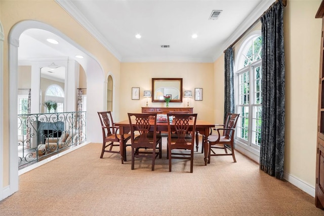 dining room featuring ornamental molding, light colored carpet, visible vents, and recessed lighting