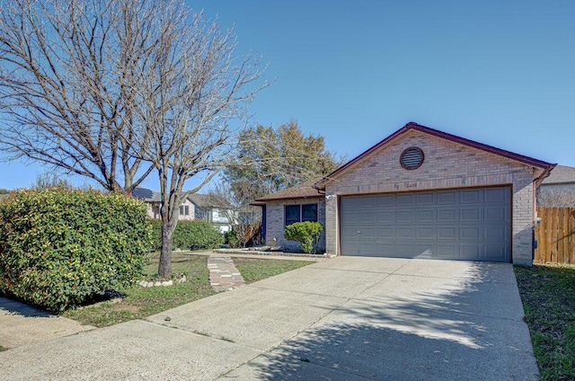 ranch-style house featuring concrete driveway, brick siding, an attached garage, and fence