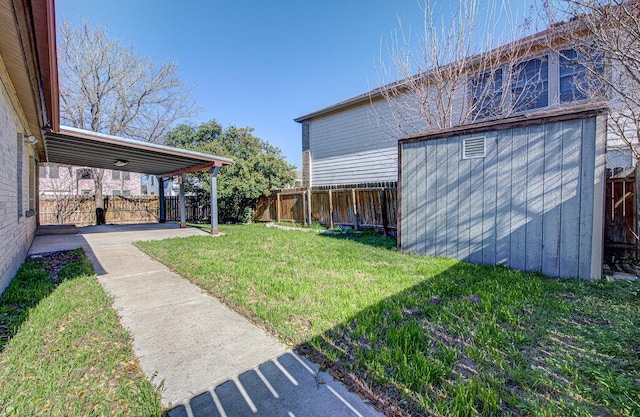 view of yard featuring a patio, a storage unit, an outdoor structure, and a fenced backyard