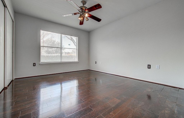 empty room featuring wood-type flooring and a ceiling fan