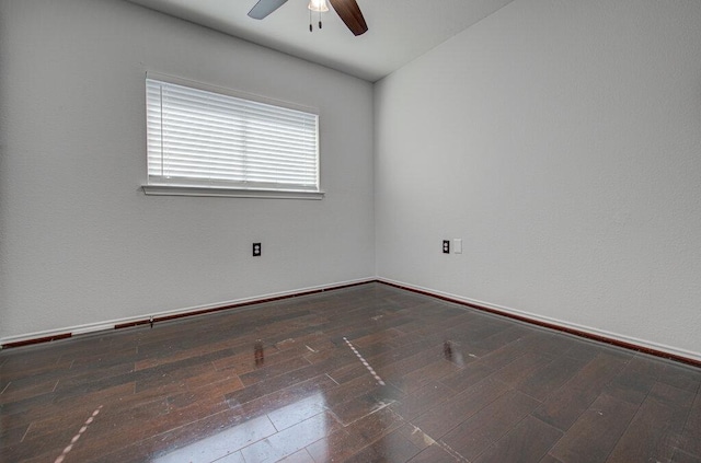 spare room with a ceiling fan and hardwood / wood-style flooring