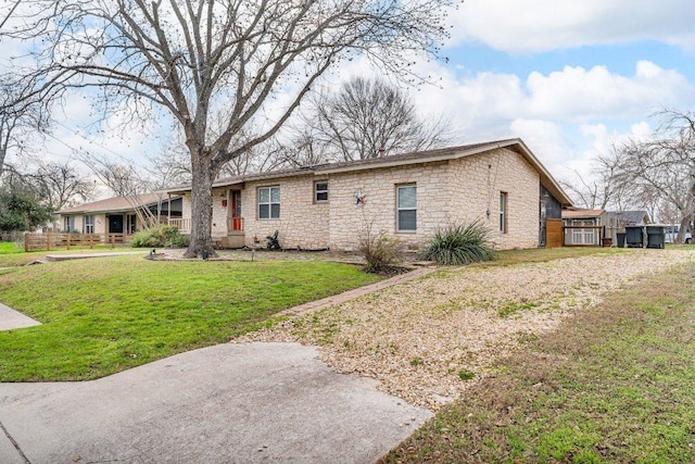 ranch-style house with a front lawn