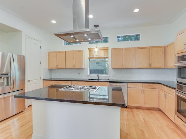 kitchen featuring light brown cabinetry, appliances with stainless steel finishes, a kitchen island, and island range hood