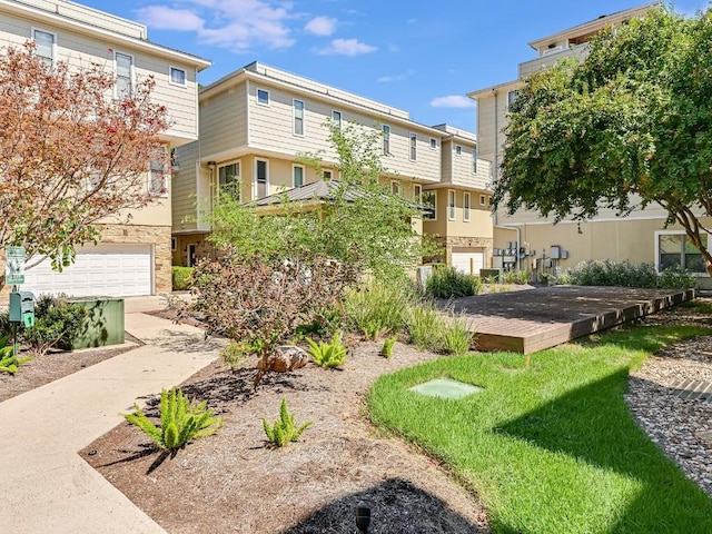 view of home's community with an attached garage