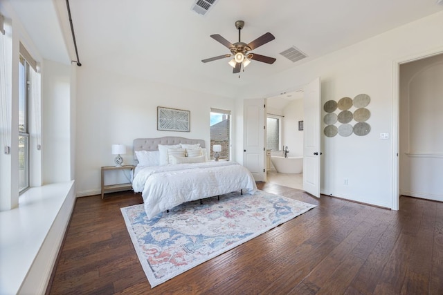 bedroom featuring dark wood-type flooring, a ceiling fan, visible vents, and baseboards