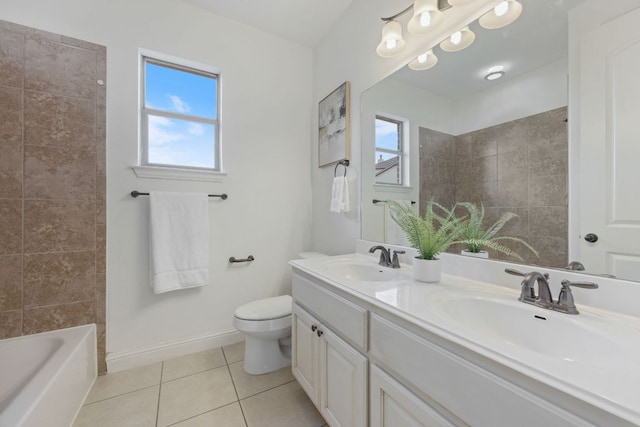 full bath with a wealth of natural light, a sink, and tile patterned floors