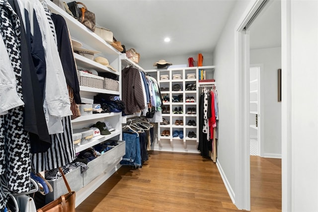 spacious closet with wood finished floors