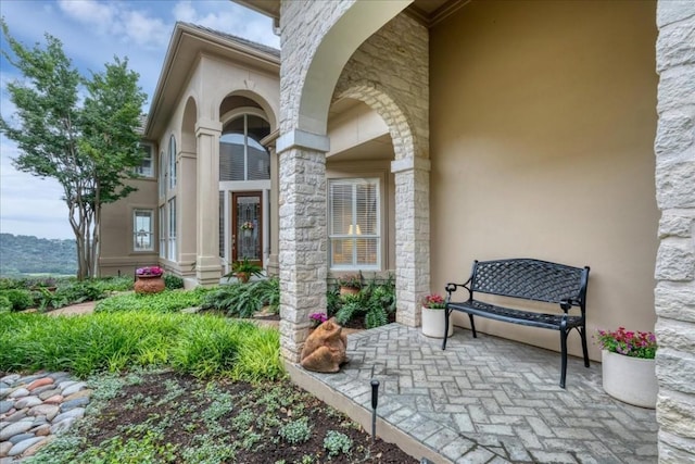 entrance to property with stucco siding