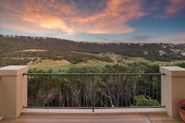 view of balcony at dusk