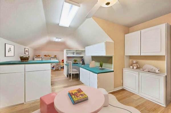 interior space featuring light wood-style floors and lofted ceiling