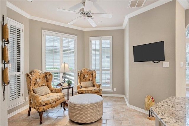 sitting room featuring ornamental molding, visible vents, baseboards, and a ceiling fan