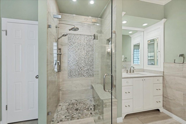 full bathroom featuring a shower stall and vanity