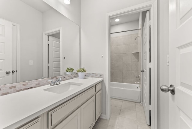 bathroom featuring bathtub / shower combination, vanity, and tile patterned floors