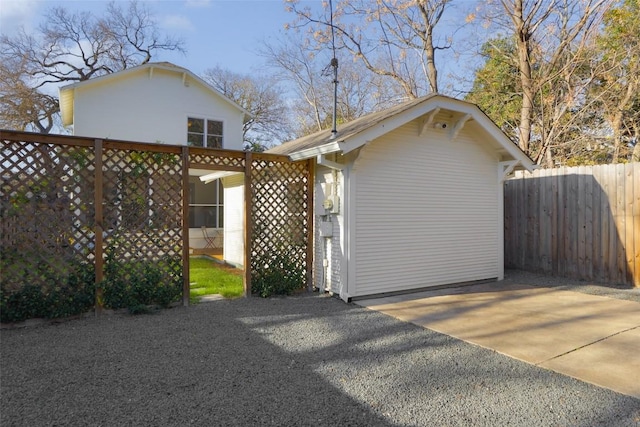 exterior space with driveway and fence