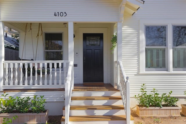 doorway to property featuring a porch