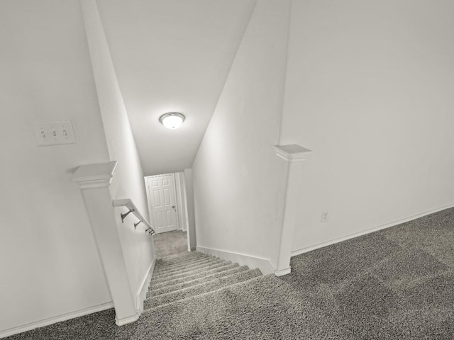 stairs featuring carpet flooring and baseboards