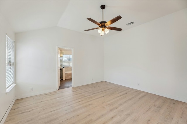 unfurnished room with a ceiling fan, light wood-type flooring, visible vents, and lofted ceiling