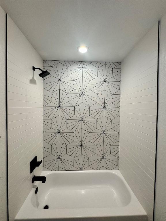 203 Little Lake Rd, Hutto, TX 78634 - bathroom featuring shower / tub combination