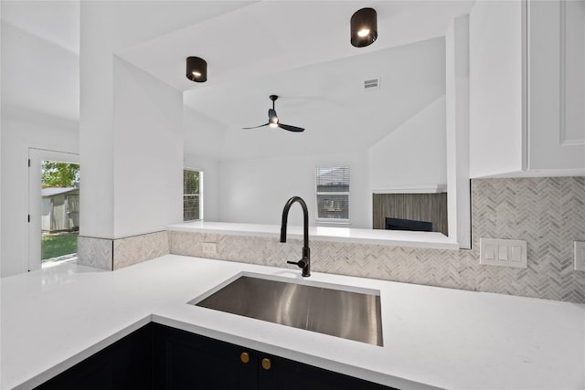 203 Little Lake Rd, Hutto, TX 78634 - kitchen featuring light countertops, ceiling fan, backsplash, healthy amount of natural light, and lofted ceiling