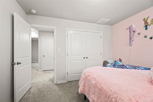 bedroom featuring carpet, a closet, visible vents, and baseboards