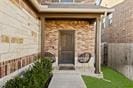 doorway to property featuring fence